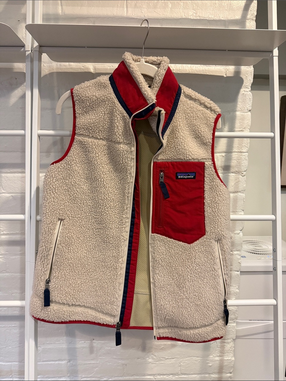 Patagonia Cream Sherpa Vest with Red and Navy Trim. Women’s small.